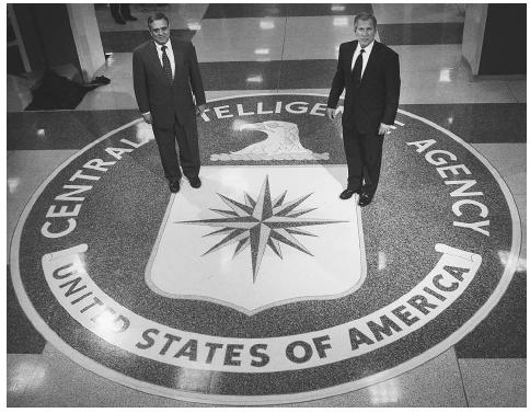 President Bush, right, and George Tenet, left, head of the Central Intelligence Agency, pause at the entrance to agency headquarters on the way to a speech in March, 2001, in which the president thanked CIA employees for their service and spoke of the importance of intelligence collection and analysis in a world that includes many new threats to U.S. security. AP/WIDE WORLD PHOTOS.