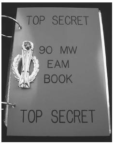 A top-secret procedure manual used for instructing military officers in the event of a nuclear missile launch rests on a desk at the Warren Air Force Base missile launch complex. ©JAMES A. SUGAR/CORBIS