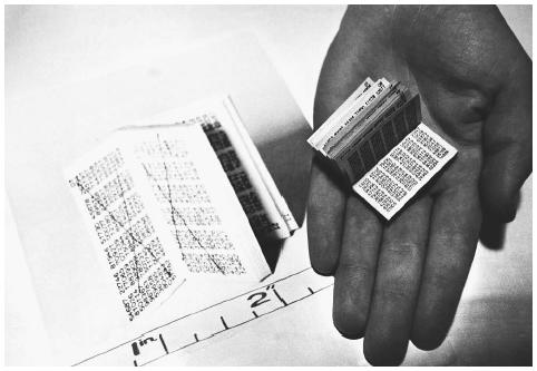 A 1968 miniature Kroger's codebook containing a series of numbers that was used by spies to decode messages from Moscow, displayed beside an enlarged photocopy of the text. ©HULTON-DEUTSCH COLLECTION/CORBIS.