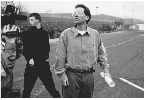 Convicted computer hacker Kevin Mitnick, right, after being released from the Federal Correction Institute in Lompoc, California, in 2000, remained under a judge's order barring him from using a computer for a further three years. AP/WIDE WORLD PHOTOS.