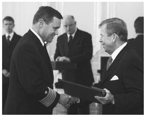 During a 2002 ceremony, former Czech President Vaclav Havel, right, presents Vice Admiral Thomas R. Wilson, director of the U.S. Defense Intelligence Agency (DIA), with the Order of the White Lion for his contributions to Czech defense and intelligence in Prague. AP/WIDE WORLD PHOTOS.