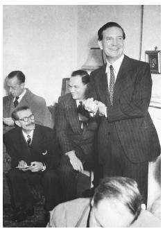 Harold "Kim " Philby (standing) is shown during a 1968 news conference after being cleared of allegations that he was the "third man" who tipped off diplomats Guy Burgess and Donald Maclean. In fact, Philby led a spy ring of former Cambridge University students, including Burgess and Maclean, for the Soviet Union. ©BETTMANN/CORBIS.