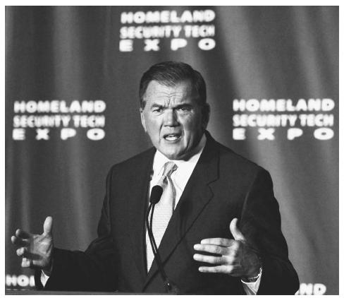 Homeland Security Director Tom Ridge addresses the Homeland Security Tech Expo at the Armory in Washington, D.C., in September 2002. Congress later approved President Bush's plan for a cabinet-level Department of Homeland Security to fight terrorism. AP/WIDE WORLD PHOTOS.