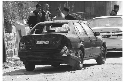 The car belonging to the wife of a senior anti-terrorism official in Jordan was destroyed in a February 2002, explosion in response to Jordan's support for the U.S.-led campaign against terrorism. AP/WIDE WORLD PHOTOS.