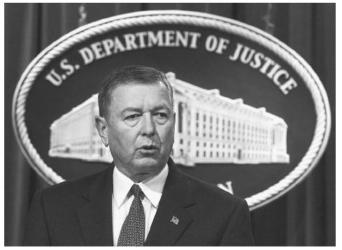Attorney General John Ashcroft briefs reporters at a press conference at the Justice Department in Washington, D.C., on October 29, 2001, as the FBI issued a new terrorism warning asking Americans and law enforcement to be on the highest alert for possible attacks in the United States and abroad. AP/WIDE WORLD PHOTOS.