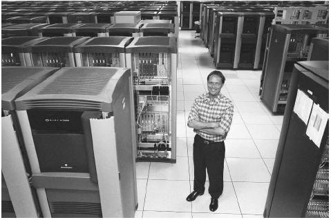 A program director of the nuclear weapons computing department at Los Alamos National Laboratory stands among the many components of a supercomputer called Blue Mountain at the lab in Los Alamos, New Mexico. AP/WIDE WORLD PHOTOS.
