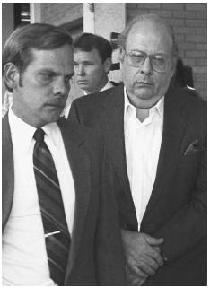 Michael Raymond, right, is escorted from federal court in 1986 after being sentenced on a weapons charge and served with a Florida murder warrant. Raymond worked as an FBI "mole" uncovering political corruption in Chicago and New York in exchange for leniency. AP/WIDE WORLD PHOTOS.