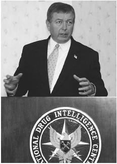 Attorney General John Ashcroft, speaking at a news conference at the National Drug Intelligence Center in Johnstown, Pennsylvania, in August, 2002, said that the technology now being used to combat illicit drugs has also proven useful in tracking the movement of terrorist groups. AP/WIDE WORLD PHOTOS.
