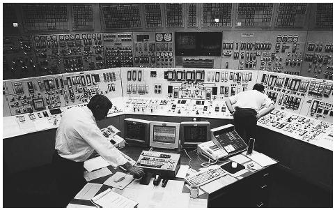 Workers man the control room of the Davis-Besse Nuclear Station in Oak Harbor, Ohio. The Nuclear Regulatory Commission, after an examination of the facility, concluded that no radiation was released after the plant took a direct blow from a tornado in 1998. AP/WIDE WORLD PHOTOS.