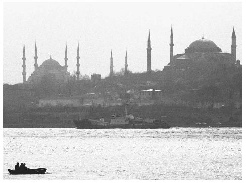 The Liman, center, an intelligence-gathering vessel of Russia's Black Sea Fleet, sails through the Bosphorus Strait in 1999 on a mission to gain information about conflicts among the Balkan states. AP/WIDE WORLD PHOTOS.