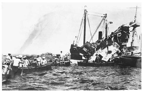 Lifeboats rescue surviving crewmen of the wrecked USS Maine anchored in Havana, Cuba, after an explosion destroyed the battleship in 1898, serving as the catalyst for the outbreak of the Spanish-American War. AP/WIDE WORLD PHOTOS.