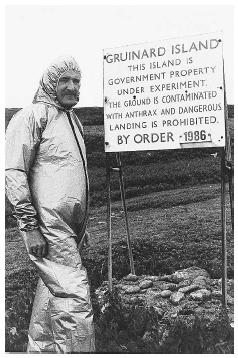 A member of the Ministry of Defense Chemical Defense Establishment stands near a warning sign in Gruinard Island, Scotland, the site of explosive munitions testing using anthrax spores as a biological weapon. The island was sealed off from the public for almost 50 years. AP/WIDE WORLD PHOTOS.