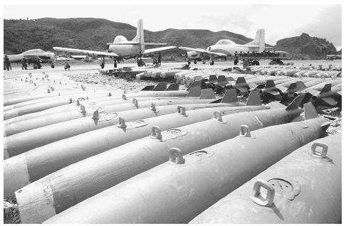 Converted T-28 trainer aircraft and 250-pound bombs used by Meo pilots of Vang Pao's "mini-Air Force," a CIA-sponsored unit that fought against the North Vietnamese in northern Laos in 1972. ©BETTMANN/CORBIS.